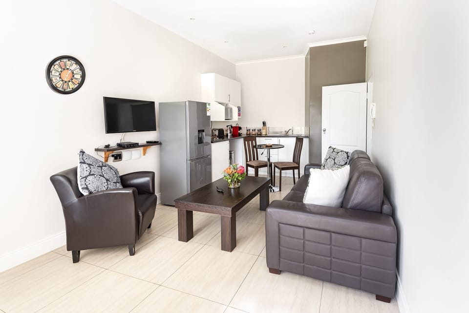 Executive Apartment, 1 Bedroom, Kitchenette, Garden View | Living area | 32-inch flat-screen TV with cable channels, TV