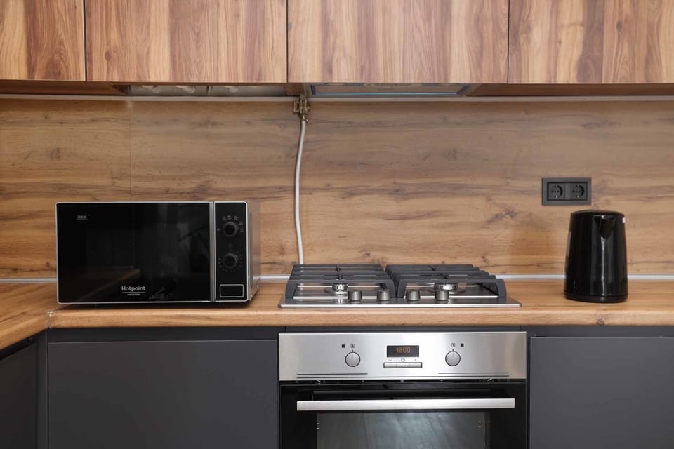 Family Apartment | Private kitchen | Fridge, microwave, oven, stovetop