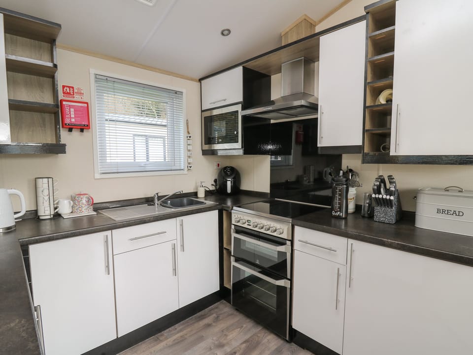 Fridge, electric kettle, toaster, cookware/dishes/utensils