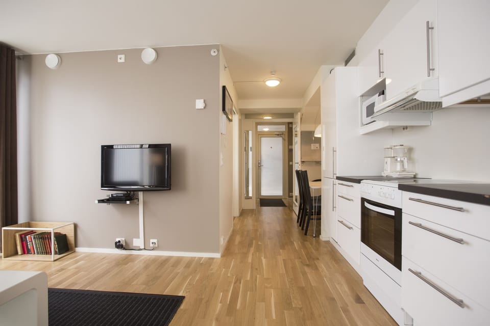 Business Apartment | Living area | 42-inch flat-screen TV with digital channels