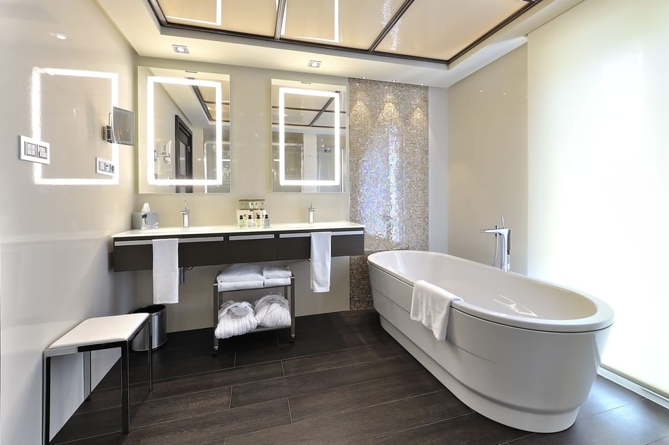 Separate tub and shower, rainfall showerhead, hair dryer, bathrobes