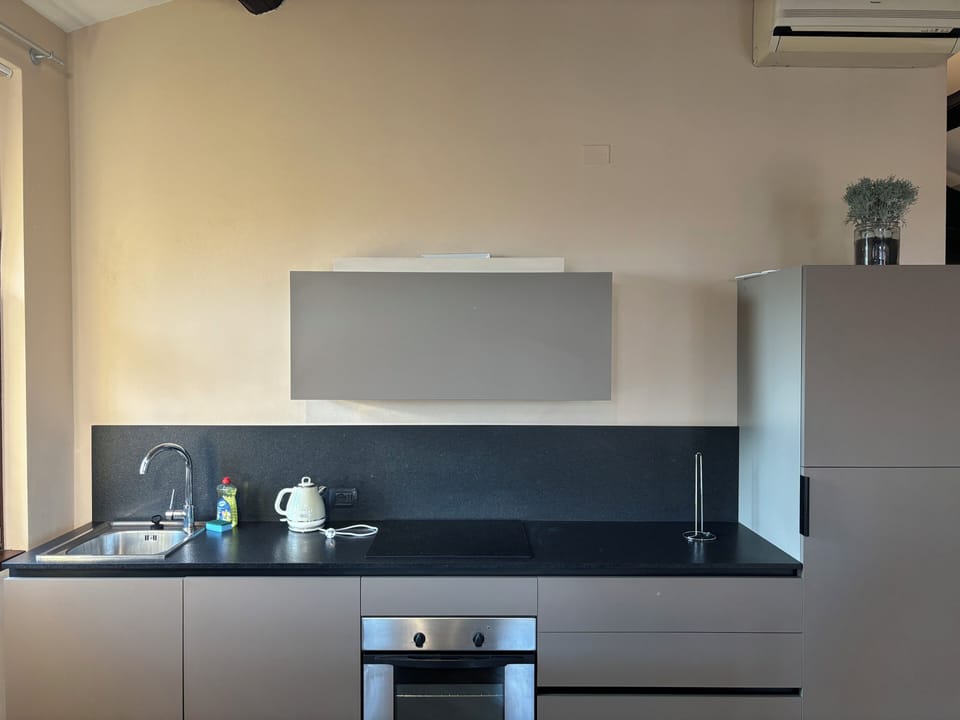 Deluxe Condo | Private kitchenette | Full-size fridge, oven, stovetop, dishwasher