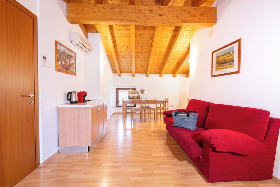 Deluxe Apartment, 2 Bedrooms | Living room | 26-inch flat-screen TV with satellite channels, TV