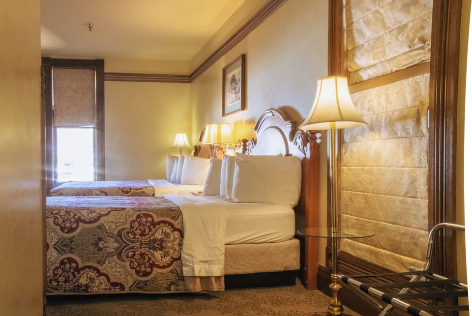 Room, 2 Queen Beds, Non Smoking | Individually decorated, individually furnished, free WiFi, bed sheets