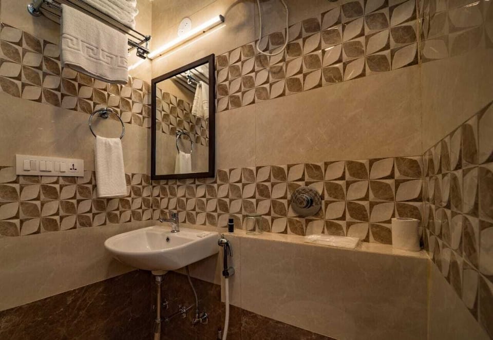 Shower, rainfall showerhead, slippers, towels