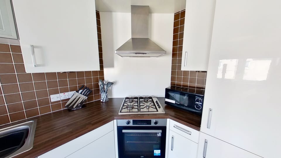 Apartment, 4 Bedrooms | Private kitchen | Fridge, microwave, coffee/tea maker, electric kettle
