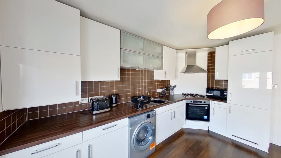 Apartment, 4 Bedrooms | Private kitchen | Fridge, microwave, coffee/tea maker, electric kettle