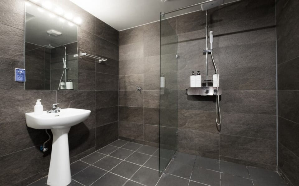 Shower, rainfall showerhead, hair dryer, towels