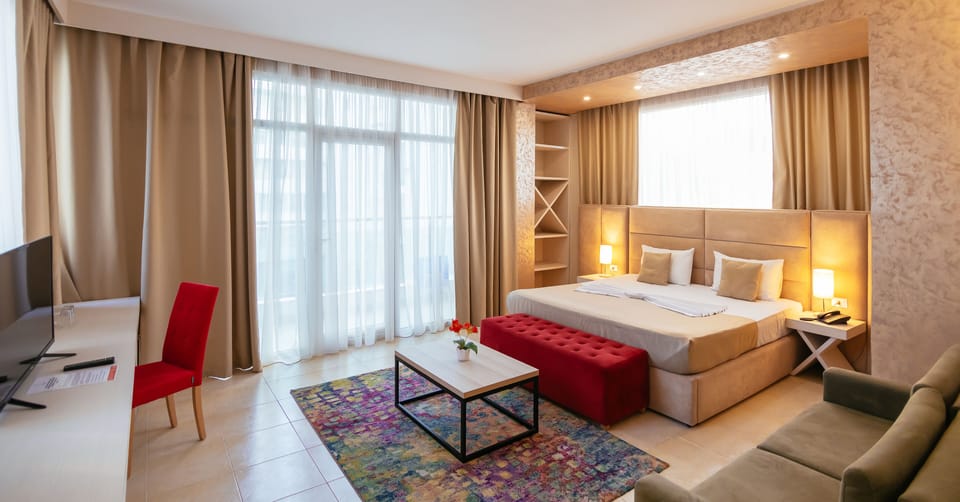 Suite, 1 King Bed, Beach View | Minibar, desk, blackout drapes, iron/ironing board