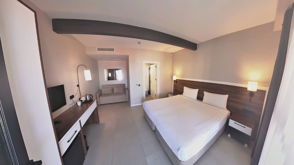 Standard Quadruple Room, Private Bathroom, Sea View | Premium bedding, minibar, in-room safe, blackout drapes