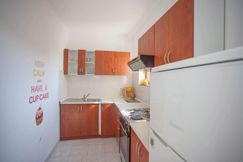 Apartment, 2 Bedrooms, Partial Ocean View | Private kitchen | Coffee/tea maker, electric kettle