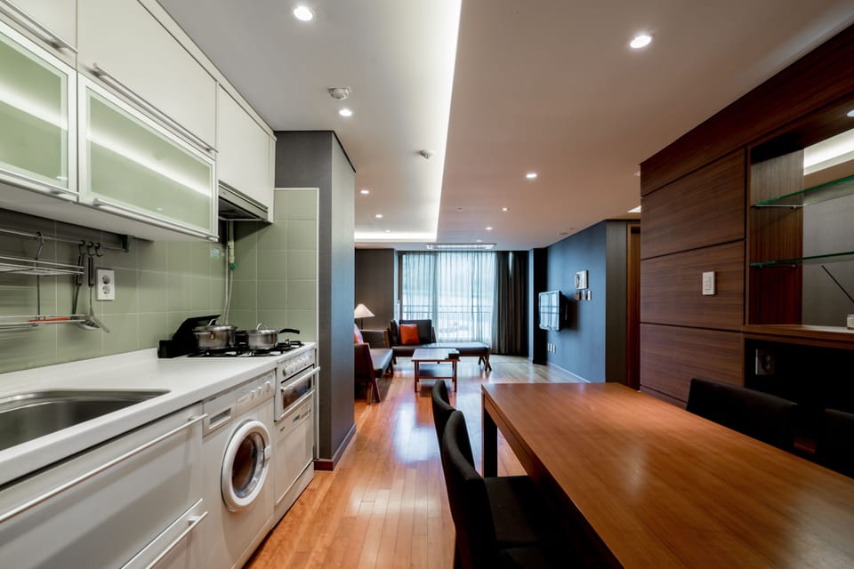 Two Bedroom Deluxe Suite | Private kitchen | Fridge, microwave, electric kettle