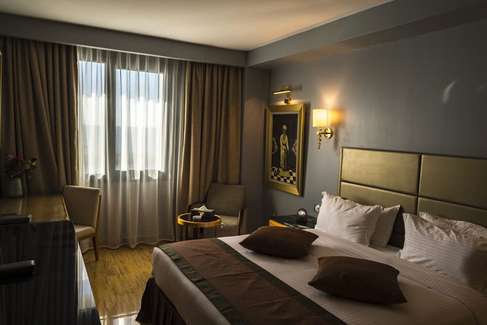 Deluxe Double or Twin Room | In-room safe, desk, laptop workspace, blackout drapes