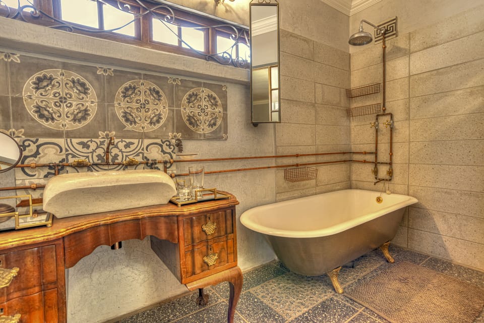 Chocolate Suite | Bathroom | Combined shower/tub, deep soaking tub, rainfall showerhead, hair dryer