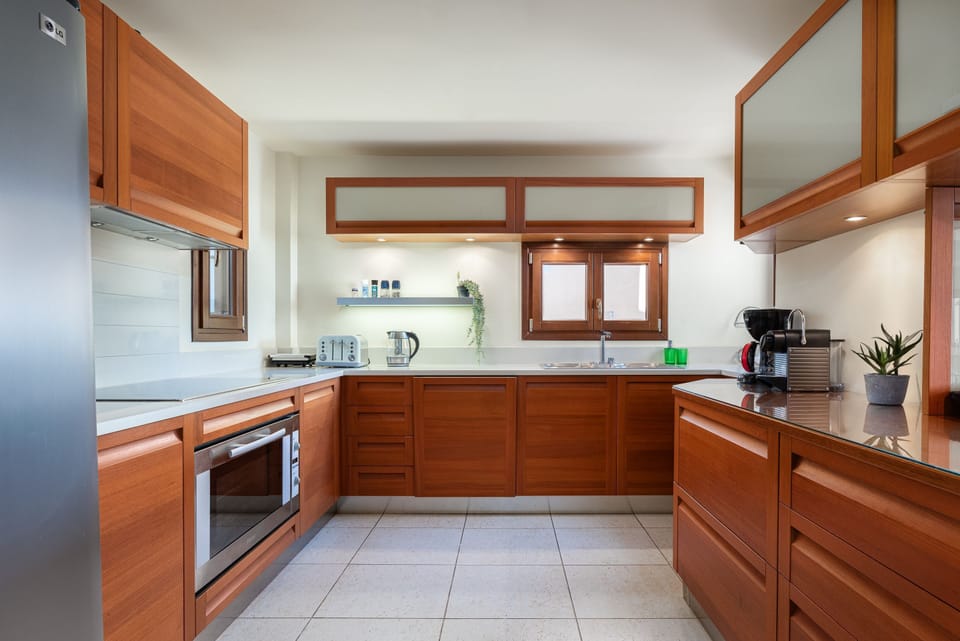 Luxury Villa | Private kitchen | Full-size fridge, microwave, oven, stovetop
