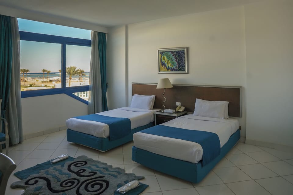 In-room safe, individually furnished, iron/ironing board, bed sheets