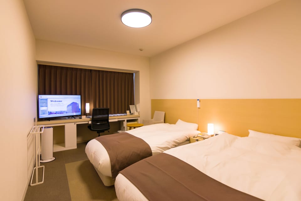 Semi Double Room with Extra Bed, Non Smoking | Down comforters, desk, laptop workspace, blackout drapes