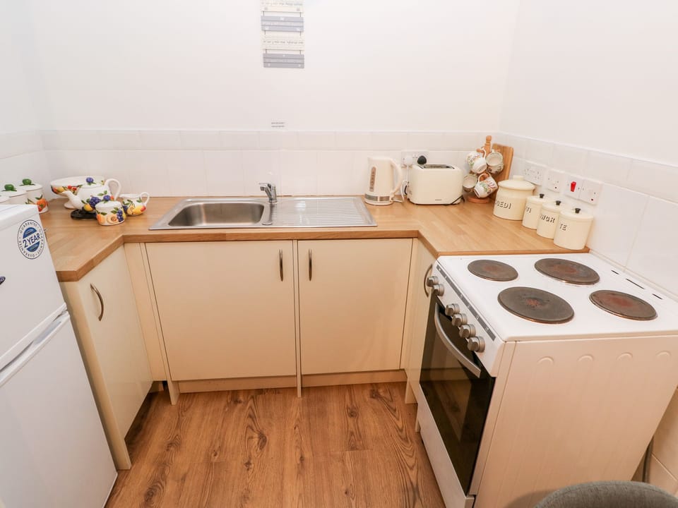 Fridge, electric kettle, toaster, cookware/dishes/utensils