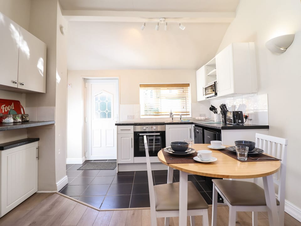 Fridge, electric kettle, toaster, cookware/dishes/utensils