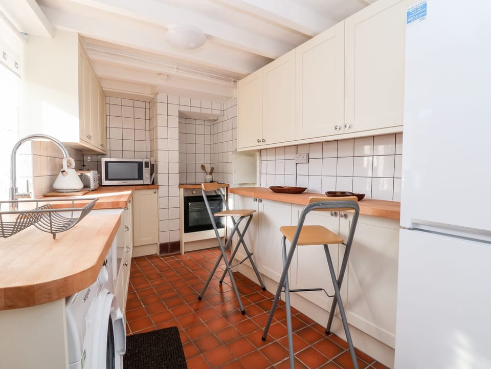 Fridge, electric kettle, toaster, cookware/dishes/utensils