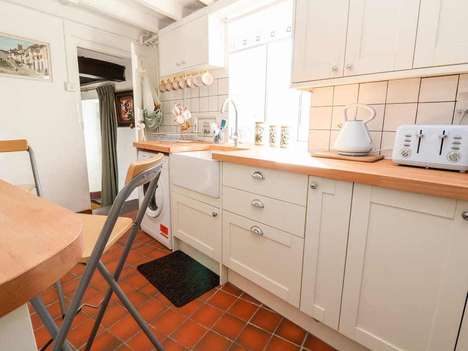 Fridge, electric kettle, toaster, cookware/dishes/utensils