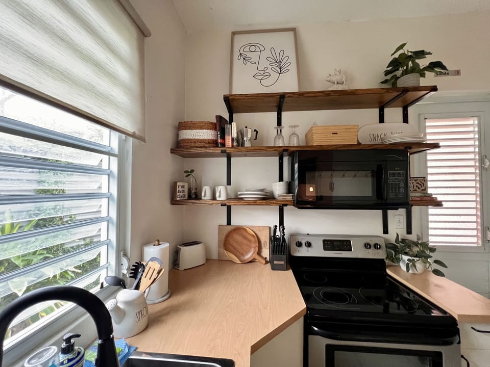 Family Suite | Private kitchen | Full-size fridge, highchair, cleaning supplies, freezer