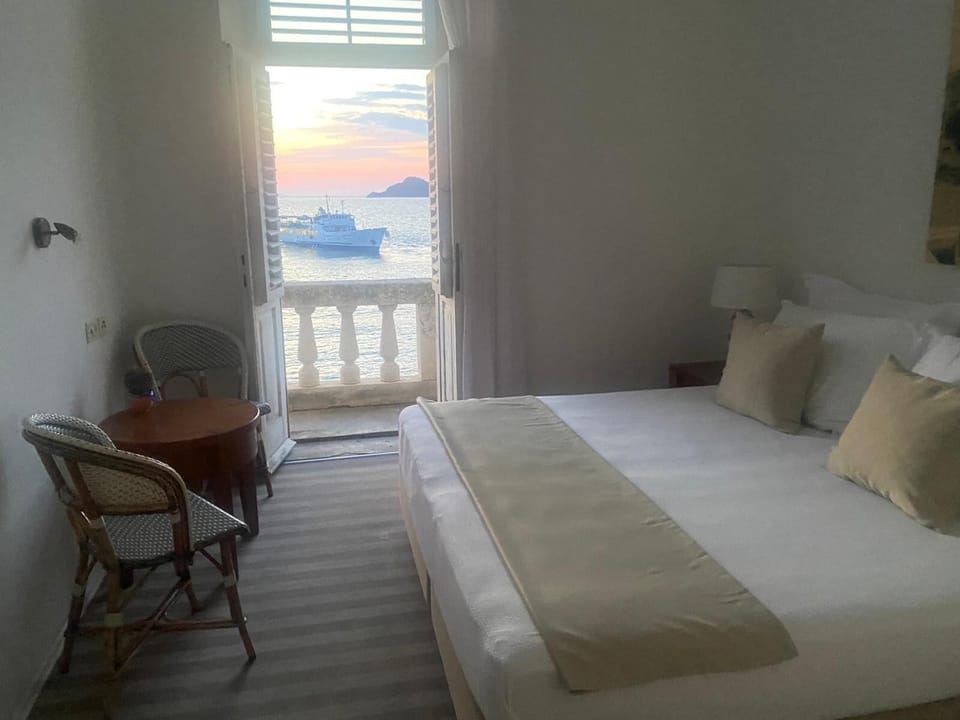 Romantic Double Room, Balcony, Sea View | 1 bedroom, in-room safe, desk, iron/ironing board