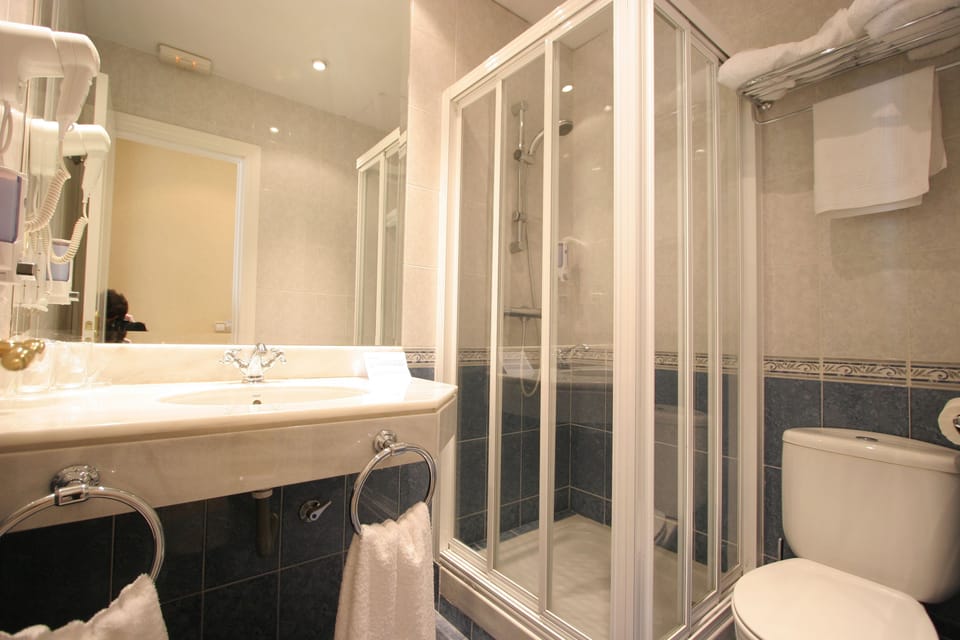 Shower, free toiletries, hair dryer, towels