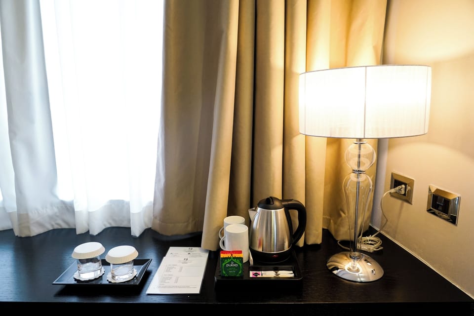 Premium bedding, down comforters, minibar, in-room safe