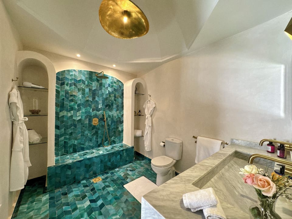 Luxury Suite, 1 Queen Bed | Bathroom | Deep soaking tub, rainfall showerhead, designer toiletries, hair dryer