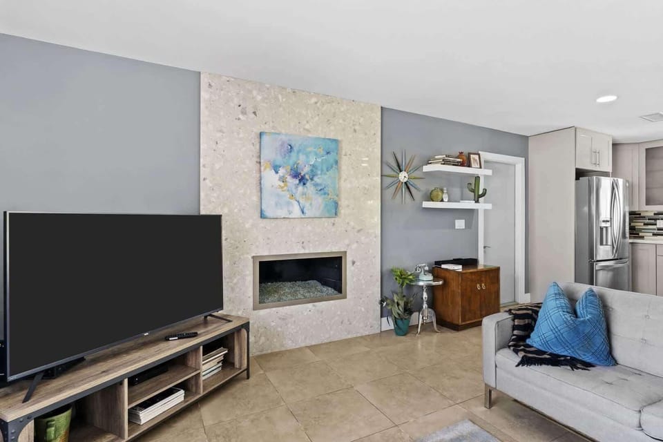 House, Multiple Beds, Pool Access, Pool View (Tiki Time Getaway) | Living area | 50-inch flat-screen TV with digital channels, fireplace