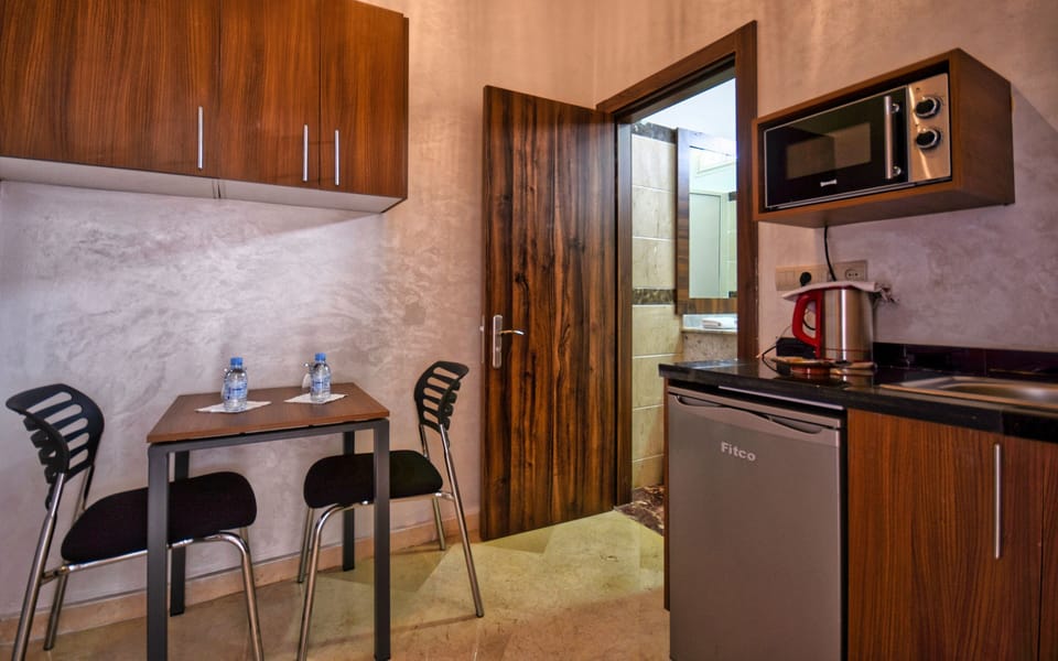 Standard Double Room, Ensuite, Beach View | Private kitchen | Highchair