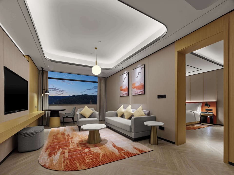 Deluxe Suite, 1 King Bed | Living area | TV