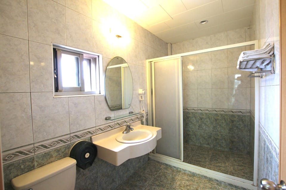 Quadruple Room, Balcony | Bathroom | Deep soaking tub, free toiletries, hair dryer, slippers