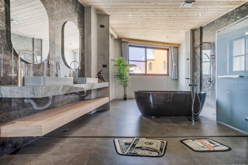 Four-Bedroom Holiday Home | Bathroom | Separate tub and shower, hair dryer, slippers, towels