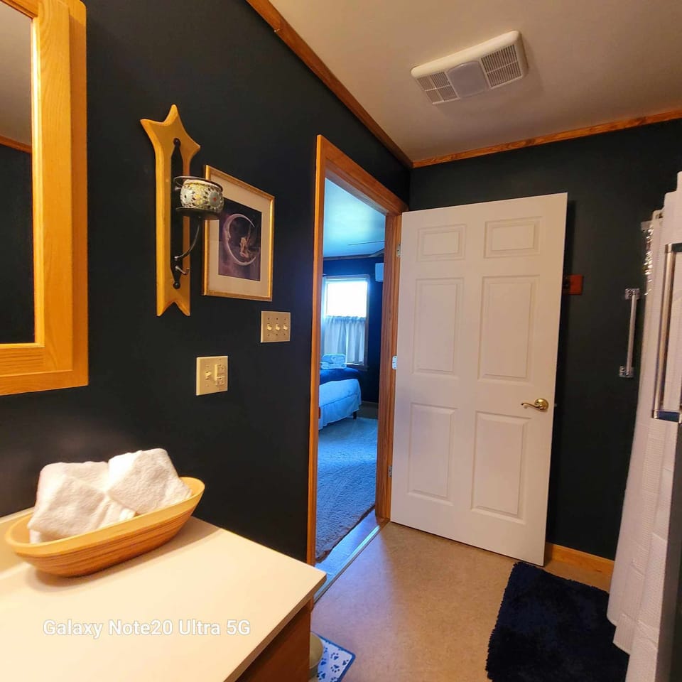 The Master Suite | Bathroom | Designer toiletries, hair dryer, bathrobes, slippers