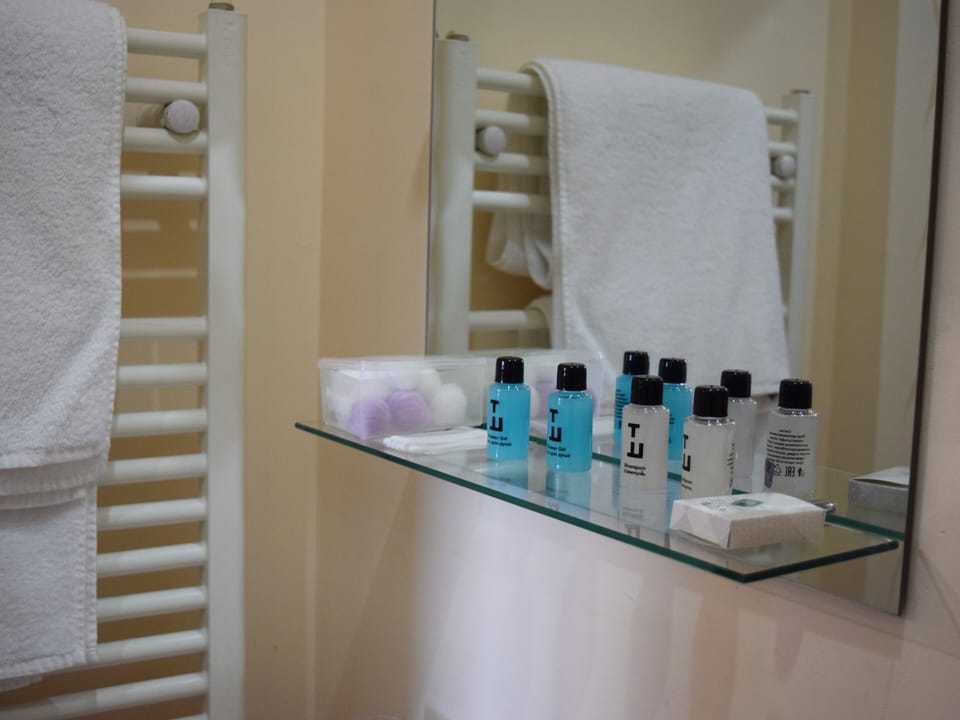 Shower, free toiletries, hair dryer, slippers