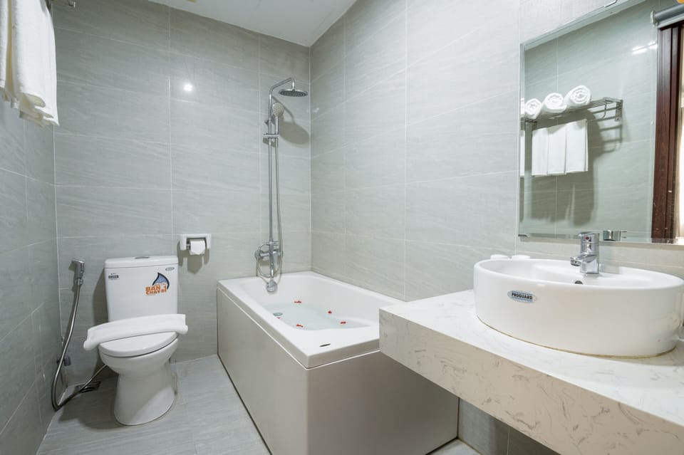 Family Double Room, 2 Queen Beds, Bathtub, City View | Bathroom | Bathtub, designer toiletries, hair dryer, slippers