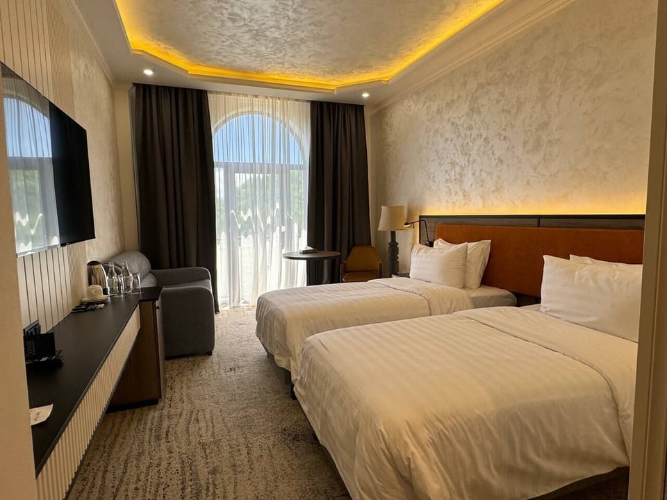 Standard Twin Room | Desk, blackout drapes, soundproofing, iron/ironing board