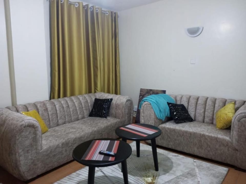 Deluxe Apartment | Living area | 24-inch Smart TV with digital channels