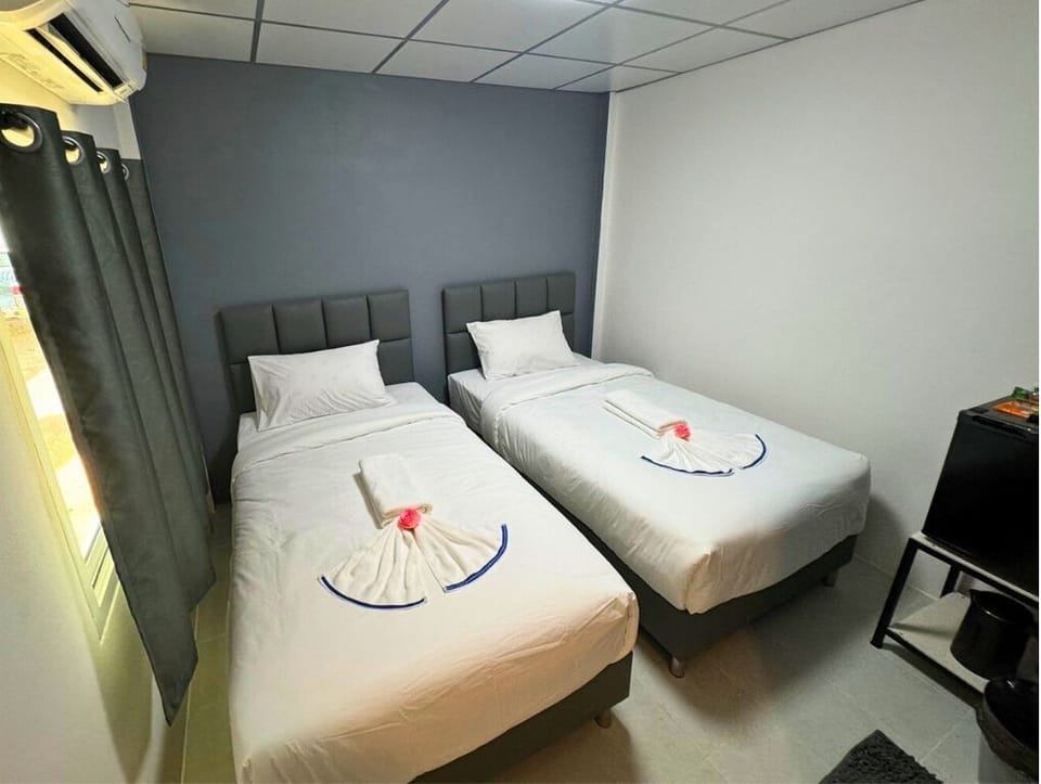 Basic Twin Room | Minibar (free items), blackout drapes, iron/ironing board (on request)