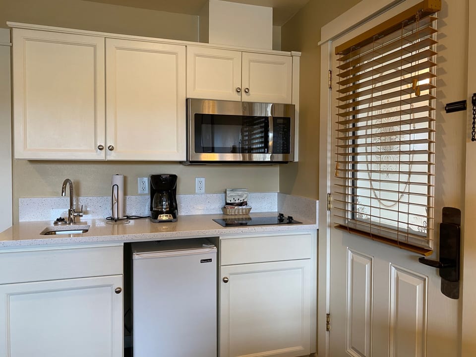 Queen Suite with sofabed, 1st Floor, Kitchenette, Non-Pet | Private kitchenette | Coffee/tea maker, fridge, microwave, cookware/dishes/utensils