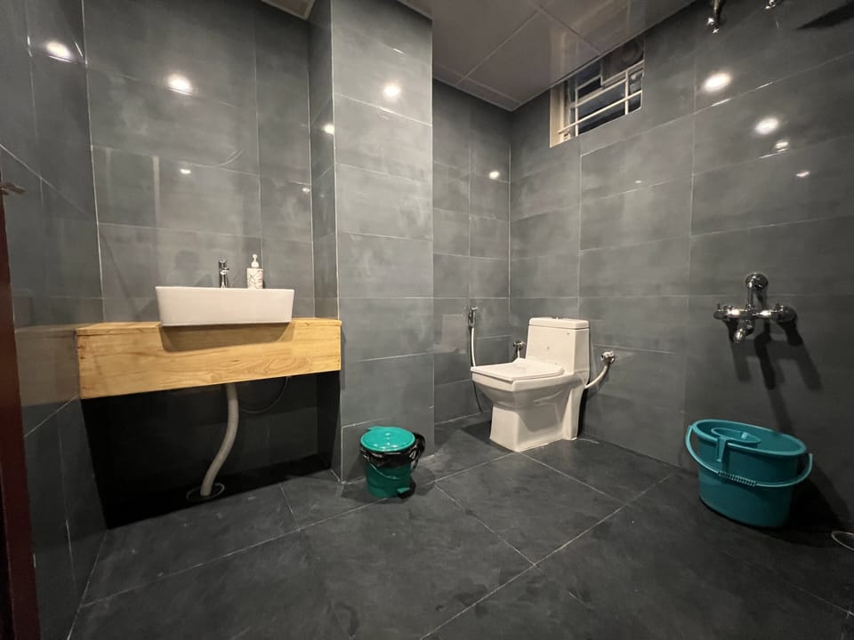 Deluxe Room | Bathroom | Hair dryer, slippers, towels, soap