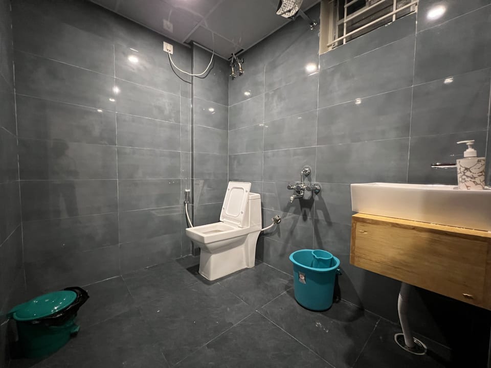 Deluxe Room | Bathroom | Hair dryer, slippers, towels, soap