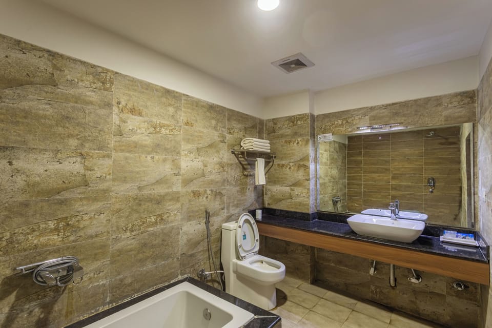 Superior Family Triple Room | Bathroom | Free toiletries