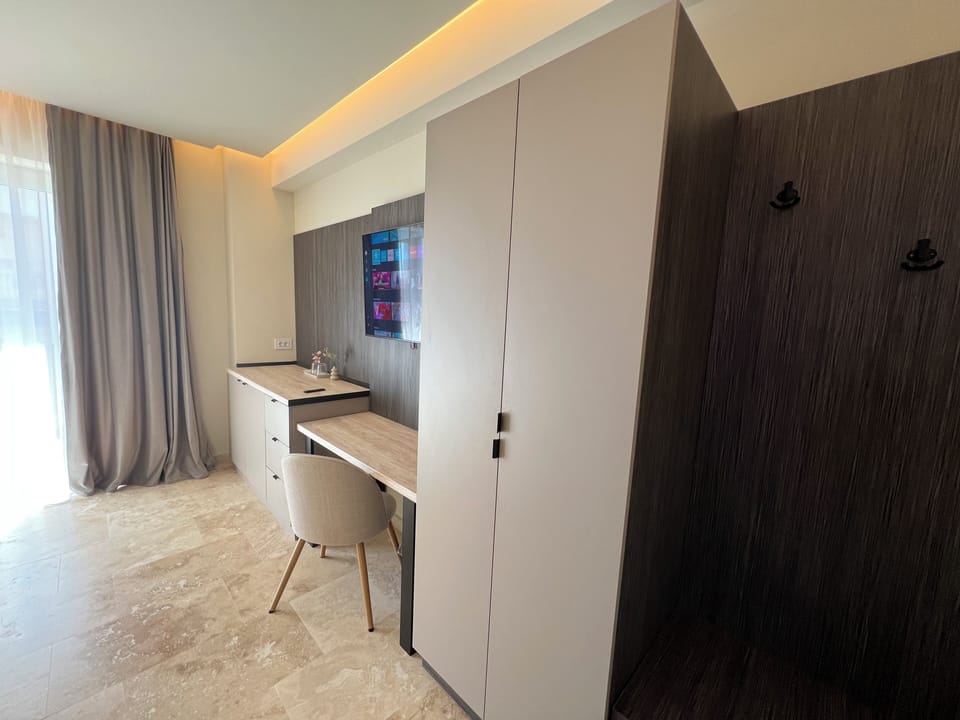 Queen room with balcony | In-room safe, individually decorated, individually furnished, desk