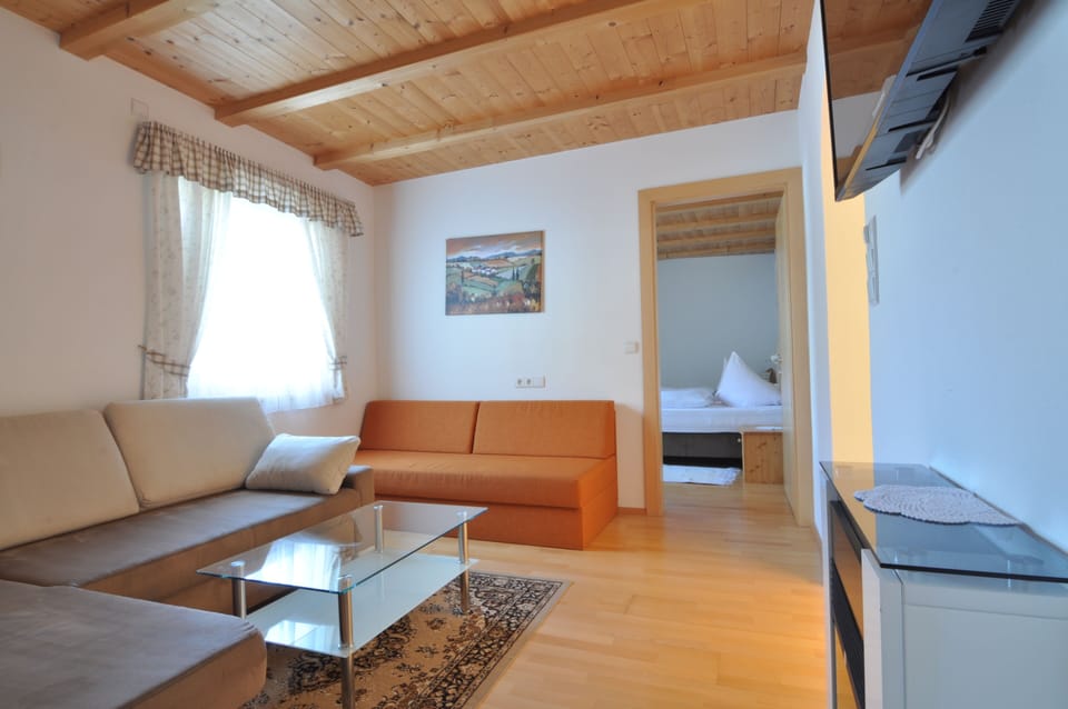 Quadruple Room | Living area | 48-inch Smart TV with satellite channels, TV, heated floors