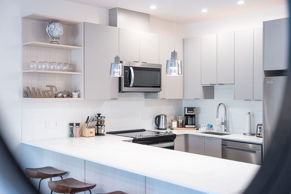 Condo, 2 Bedrooms | Private kitchen | Coffee/tea maker, full-size fridge, microwave, oven