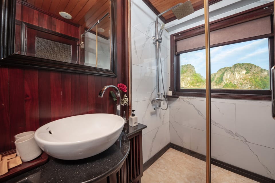 Shower, rainfall showerhead, designer toiletries, hair dryer