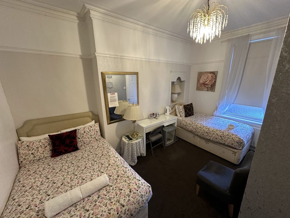 Standard Triple Room | Laptop workspace, iron/ironing board, free WiFi, bed sheets